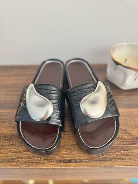 Tory Burch Black Patent Patos Slide Mules with Silver Tear-Drop Accent
